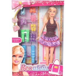 Lalka w sukience w cętki w zestawie z 8 parami butów